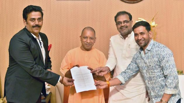 Ravi Kishan and Nirahua with CM Yogi Adityanath (HT) Ravi Kishan and Nirahua with CM Yogi Adityanath (HT)