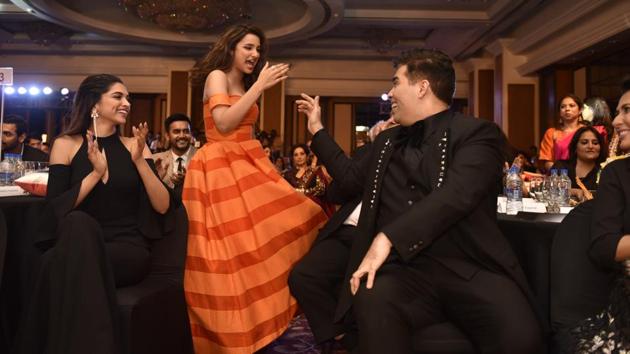 Parineeti Chopra ensured that the evening was fun. Seen here with Deepika Padukone and Karan Johar.  (Anshuman Poyrekar/HT Photo) 