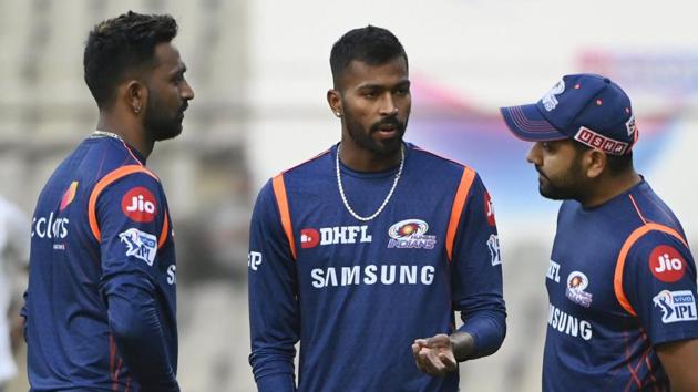 Mumbai Indians' captain Rohit Sharma with teammates Krunal and Hardik Pandya during a practice session.(PTI)