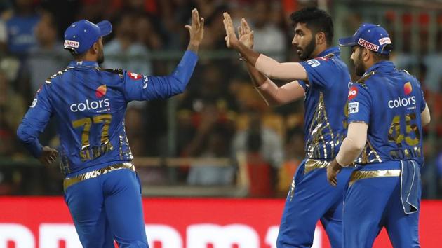 Mumbai Indians' Jasprit Bumrah, center, celebrates with teammates the dismissal of Royal Challengers Bangalore's Shimron Hetmyer.(AP) Mumbai Indians' Jasprit Bumrah, center, celebrates with teammates the dismissal of Royal Challengers Bangalore's Shimron Hetmyer.(AP)