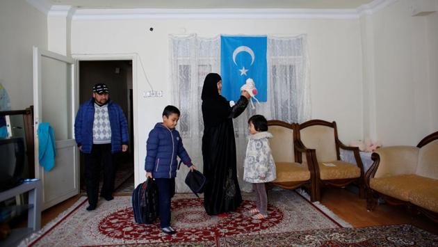 Qurbanjan Nourmuhammed and his wife Gulgine Mahmut get their children ready for school at their home in Istanbul. Nourmuhammed, his wife and five children came to Turkey in 2015, facing increased pressure from China to abandon Islamic practices such as wearing a headscarf, growing a beard and closing their restaurant for the Muslim holy month of Ramadan. (Murad Sezer / REUTERS) Qurbanjan Nourmuhammed and his wife Gulgine Mahmut get their children ready for school at their home in Istanbul. Nourmuhammed, his wife and five children came to Turkey in 2015, facing increased pressure from China to abandon Islamic practices such as wearing a headscarf, growing a beard and closing their restaurant for the Muslim holy month of Ramadan. (Murad Sezer / REUTERS)