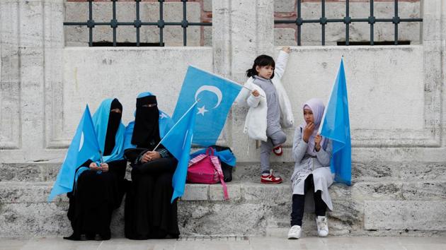 Uighur women hold East Turkestan flags at the courtyard of Fatih Mosque. Turkey is the only Muslim country that has regularly expressed concern about the situation in Xinjiang, due to its close cultural links with the Uighurs who speak a Turkic language. (Murad Sezer / REUTERS) Uighur women hold East Turkestan flags at the courtyard of Fatih Mosque. Turkey is the only Muslim country that has regularly expressed concern about the situation in Xinjiang, due to its close cultural links with the Uighurs who speak a Turkic language. (Murad Sezer / REUTERS)
