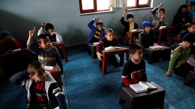 Uighur boys who have lost at least one parent, raise their hands during a Koran class in a madrasa. “Not all of the people whose passports have been labelled as risky... are problematic people,” Tumturk said. “People who can’t retrieve a required document from China can experience the same issue.” (Murad Sezer / REUTERS) Uighur boys who have lost at least one parent, raise their hands during a Koran class in a madrasa. “Not all of the people whose passports have been labelled as risky... are problematic people,” Tumturk said. “People who can’t retrieve a required document from China can experience the same issue.” (Murad Sezer / REUTERS)