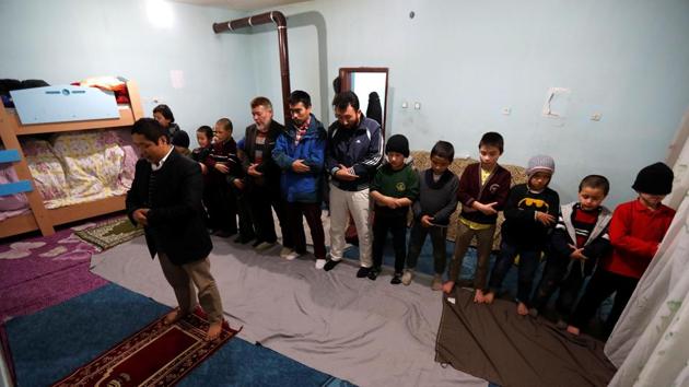 Uighur men and boys perform their evening prayers led by Ruz Mohammed, known as Hafiz Bilal, in a madrasa, in Kayseri. Perceptions of Uighurs suffered after some went to fight with jihadists against President Bashar al-Assad’s forces, because of the Syrian government’s close ties with Beijing, Tumturk said, adding China has ramped up pressure since then. (Murad Sezer / REUTERS) Uighur men and boys perform their evening prayers led by Ruz Mohammed, known as Hafiz Bilal, in a madrasa, in Kayseri. Perceptions of Uighurs suffered after some went to fight with jihadists against President Bashar al-Assad’s forces, because of the Syrian government’s close ties with Beijing, Tumturk said, adding China has ramped up pressure since then. (Murad Sezer / REUTERS)