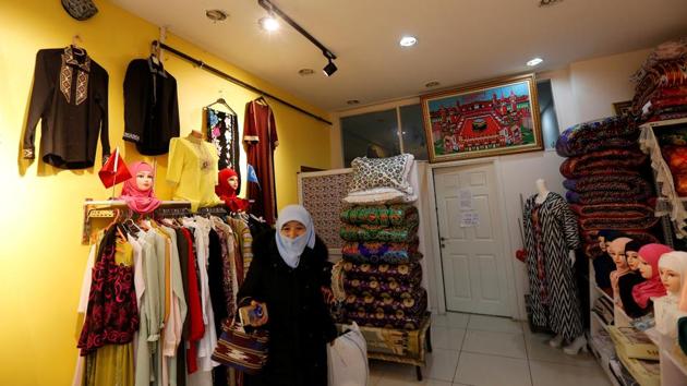 Munevver Ozuygur is seen at a store which belongs to the East Turkestan Nuzugum Culture and Family Foundation in Istanbul. Uighurs also cannot renew their Chinese passports at the local embassy when they expire and they are only given a document that will allow them to return to China, said Munevver Ozuygur, President of the Foundation. (Murad Sezer / REUTERS) Munevver Ozuygur is seen at a store which belongs to the East Turkestan Nuzugum Culture and Family Foundation in Istanbul. Uighurs also cannot renew their Chinese passports at the local embassy when they expire and they are only given a document that will allow them to return to China, said Munevver Ozuygur, President of the Foundation. (Murad Sezer / REUTERS)