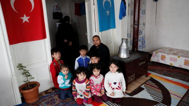 Abdulaziz Abdulvahid, a 39-year-old Uighur man who has health problems and survives on Red Crescent aid, with his wife and seven children at their home in Kayseri. Some 15 Uighurs who spoke to Reuters said they expect Turkey to pay more attention to their plight and give them the permits to allow them to work and benefit from the healthcare system. (Murad Sezer / REUTERS) Abdulaziz Abdulvahid, a 39-year-old Uighur man who has health problems and survives on Red Crescent aid, with his wife and seven children at their home in Kayseri. Some 15 Uighurs who spoke to Reuters said they expect Turkey to pay more attention to their plight and give them the permits to allow them to work and benefit from the healthcare system. (Murad Sezer / REUTERS)