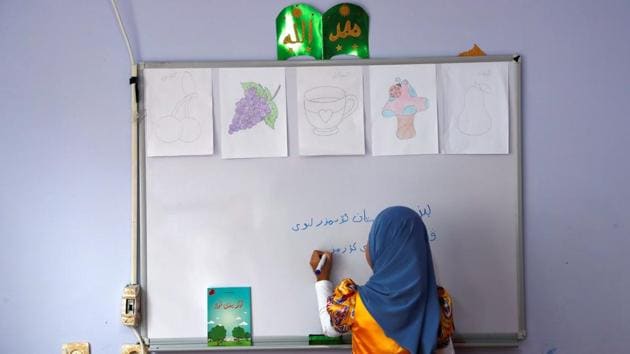 A girl writes, ‘We, children of Turkestan, love our homeland’ in the Uighur language in a classroom at a kindergarten. However, some hope has returned after Turkey took a harder stance against China at a UN Human Rights Council meeting last month, where Foreign Minister Mevlut Cavusoglu criticised Beijing for the alleged mistreatment of Uighurs and called for authorities to protect freedom of religion. (Murad Sezer / REUTERS) A girl writes, ‘We, children of Turkestan, love our homeland’ in the Uighur language in a classroom at a kindergarten. However, some hope has returned after Turkey took a harder stance against China at a UN Human Rights Council meeting last month, where Foreign Minister Mevlut Cavusoglu criticised Beijing for the alleged mistreatment of Uighurs and called for authorities to protect freedom of religion. (Murad Sezer / REUTERS)