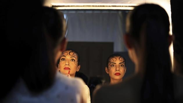 Top fashion names and models participated in Lotus Makeup India Fashion Week organized by the Fashion Design Council of India earlier this month. The show celebrated the sari, Indian women’s most idiosyncratic garment, 6 yards of fabric that symbolize a centuries-old tradition. (Manish Swarup / AP) 