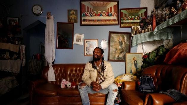Paulo Cabral, 36, born in Cova da Moura to Cape Verdean parents, at his father’s house. "Sometimes the only thing people know about Cova da Moura is the negative side,” said Cabral “But that isn’t the whole truth.” Cabral organises tours of Cova da Moura. “When you visit once you keep on coming back,” he said. “People may be poor here but they have big hearts and preserving culture is part of who we are.” (Rafael Marchante / REUTERS) Paulo Cabral, 36, born in Cova da Moura to Cape Verdean parents, at his father’s house. "Sometimes the only thing people know about Cova da Moura is the negative side,” said Cabral “But that isn’t the whole truth.” Cabral organises tours of Cova da Moura. “When you visit once you keep on coming back,” he said. “People may be poor here but they have big hearts and preserving culture is part of who we are.” (Rafael Marchante / REUTERS)