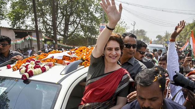 Congress General Secretary UP-East Priyanka Gandhi Vadra waves to her party supporters during a roadshow, ahead of Lok Sabha elections, at Kumarganj, in Faizabad on March 29, 2019.(PTI Photo)