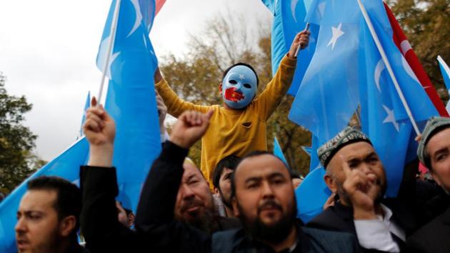 A masked Uighur boy takes part in a protest against China, at the courtyard of Fatih Mosque, a common meeting place for pro-Islamist demonstrators in Istanbul, Turkey. Without work or residency permits in Turkey and unable to renew their Chinese passports, Qurbanjan Nourmuhammed and his family live in uncertainty in Istanbul, cut off from their son who returned to Xinjiang three years ago. (Murad Sezer / REUTERS) A masked Uighur boy takes part in a protest against China, at the courtyard of Fatih Mosque, a common meeting place for pro-Islamist demonstrators in Istanbul, Turkey. Without work or residency permits in Turkey and unable to renew their Chinese passports, Qurbanjan Nourmuhammed and his family live in uncertainty in Istanbul, cut off from their son who returned to Xinjiang three years ago. (Murad Sezer / REUTERS)