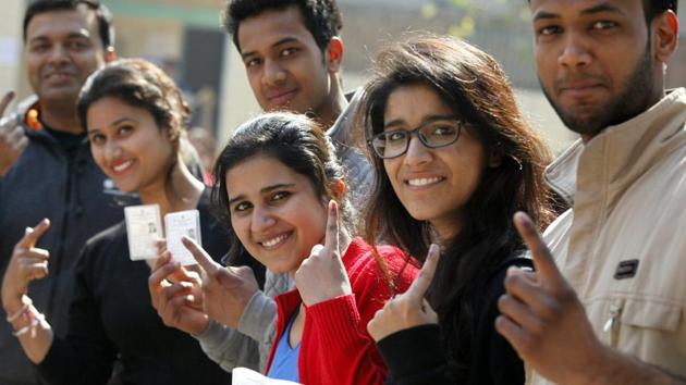 New Delhi, India - Feb. 7, 2015: Young Voters who are voting for the first time, showing their inked fingers after casting their votes for Delhi Assembly Elections, at South Delhi in New Delhi, India, on Saturday, February 7, 2015. (Photo by Raj K Raj/ Hindustan Times)(Hindustan Times)
