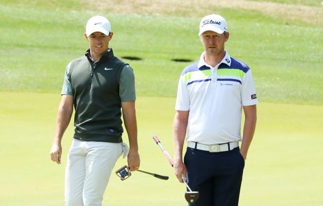 Rory McIlroy of Northern Ireland and Justin Harding of South Africa look on from the third green during the second round of the World Golf Championships-Dell Technologies Match Play at Austin Country Club on March 28, 2019 in Austin, Texas.(AFP)