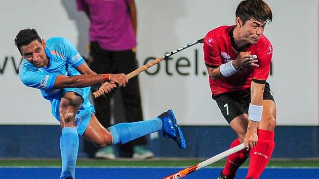 Indian hockey player Gurinder in action against Korea.(PTI)