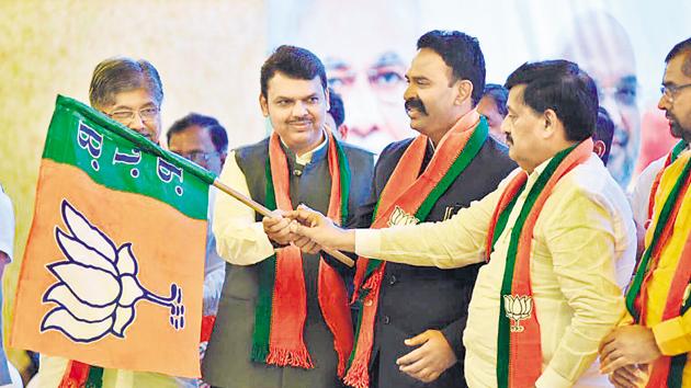 CM Devendra Fadnavis (second from left) welcomes Rajitsinh Naik Nimbalkar (second from right) into the BJP in Mumbai earlier this week. (HT PHOTO) CM Devendra Fadnavis (second from left) welcomes Rajitsinh Naik Nimbalkar (second from right) into the BJP in Mumbai earlier this week. (HT PHOTO)