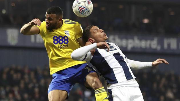 Birmingham City's Isaac Vassell, left, and West Bromwich Albion's Jake Livermore battle for a high ball.(AP)