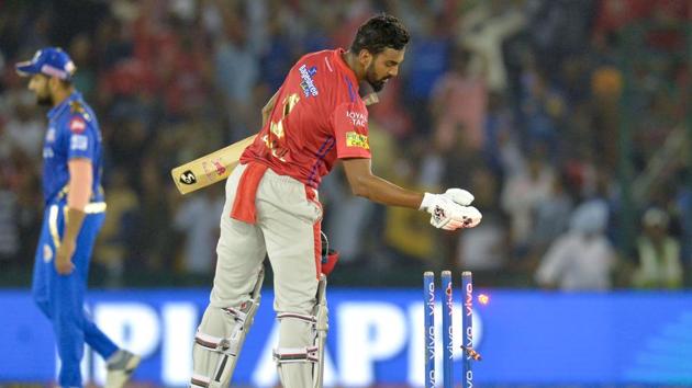 Kings XI Punjab cricketer K. L. Rahul takes off wicket bails after winning the match.(AFP)