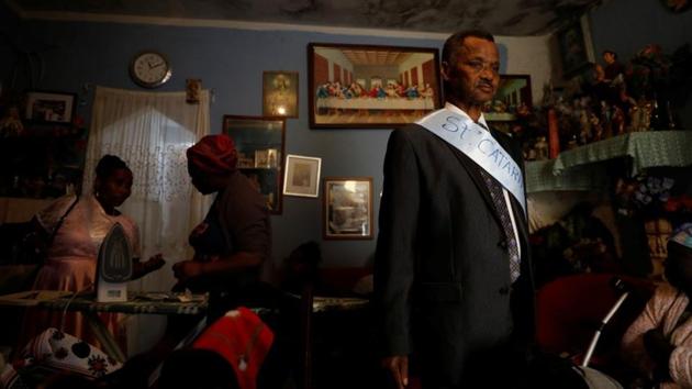 Retired Evaristo Marques, 75, prepares at his house to celebrate the day of Santa Catarina in Cova da Moura neighbourhood in Lisbon, Portugal. Marques, who was born in Cape Verde’s capital Praia, doesn't see himself living anywhere else in Lisbon. (Rafael Marchante / REUTERS) Retired Evaristo Marques, 75, prepares at his house to celebrate the day of Santa Catarina in Cova da Moura neighbourhood in Lisbon, Portugal. Marques, who was born in Cape Verde’s capital Praia, doesn't see himself living anywhere else in Lisbon. (Rafael Marchante / REUTERS)