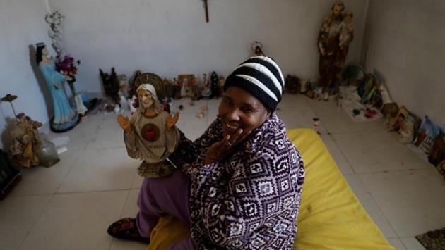 Dulce Fernandes poses with her Catholic figures in her room. “I always have a smile on my face even though I’m sick,” Dulce said. She has problems in her knees, which makes it hard for her to walk. Dulce came to Portugal in 2000. “I moved to Portugal to seek a better life, there were no jobs in Cape Verde. I have four children, without a father. I'm a strong woman,” she said. (Rafael Marchante / REUTERS) Dulce Fernandes poses with her Catholic figures in her room. “I always have a smile on my face even though I’m sick,” Dulce said. She has problems in her knees, which makes it hard for her to walk. Dulce came to Portugal in 2000. “I moved to Portugal to seek a better life, there were no jobs in Cape Verde. I have four children, without a father. I'm a strong woman,” she said. (Rafael Marchante / REUTERS)