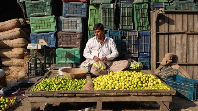 A vendor arranges lemons as he waits for customers at a fruit and vegetable wholesale market in New Delhi. (Noemi Cassanelli / AFP) A vendor arranges lemons as he waits for customers at a fruit and vegetable wholesale market in New Delhi. (Noemi Cassanelli / AFP)
