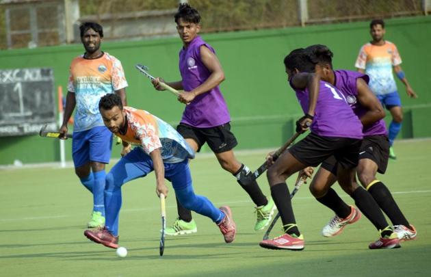 Excellency Academy (orange) in action against Rovers Academy during the first edition of Moti John hockey tournament at Dhyan Chand on Saturday. (HT PHOTO) Excellency Academy (orange) in action against Rovers Academy during the first edition of Moti John hockey tournament at Dhyan Chand on Saturday. (HT PHOTO)