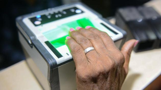 A woman getting her fingerprints read during the registration process for Aadhaar cards in Amritsar.(AFP File Photo)