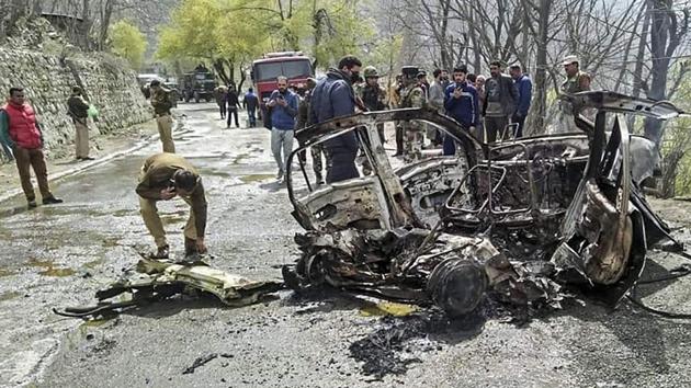 Security personnel inspect the mangled remains of a car which exploded near a CRPF convoy on the Jammu-Srinagar highway at Banihal, in Ramban district of Jammu and Kashmir, Saturday, March 30, 2019.(PTI)
