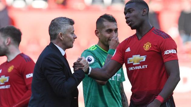 Manchester United's Norwegian manager Ole Gunnar Solskjaer (L) shakes hands with Paul Pogba (R). (AFP) Manchester United's Norwegian manager Ole Gunnar Solskjaer (L) shakes hands with Paul Pogba (R). (AFP)