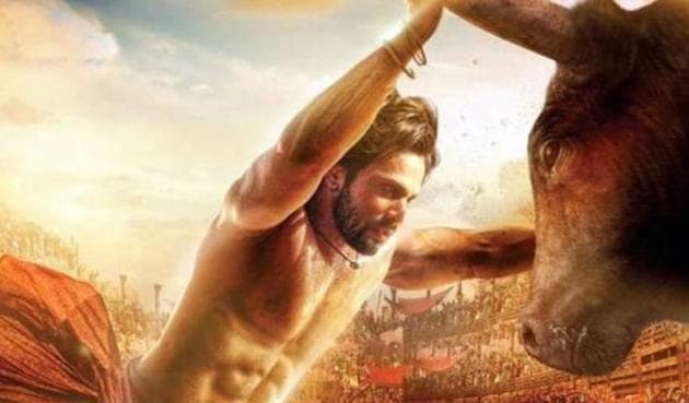 Varun Dhawan in a poster from Kalank where he is seen taking on a bull.