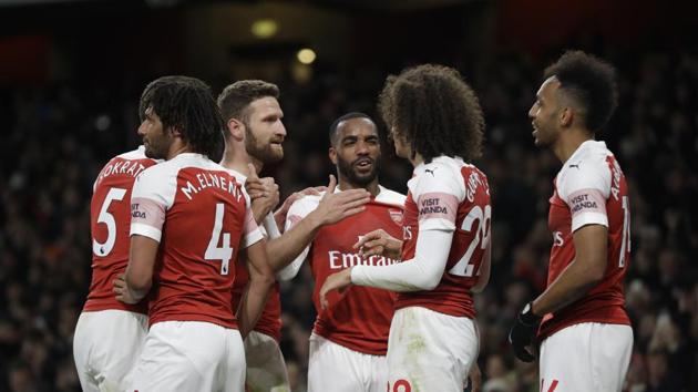 Arsenal's Alexandre Lacazette, center, celebrates scoring his side's second goal.(AP)