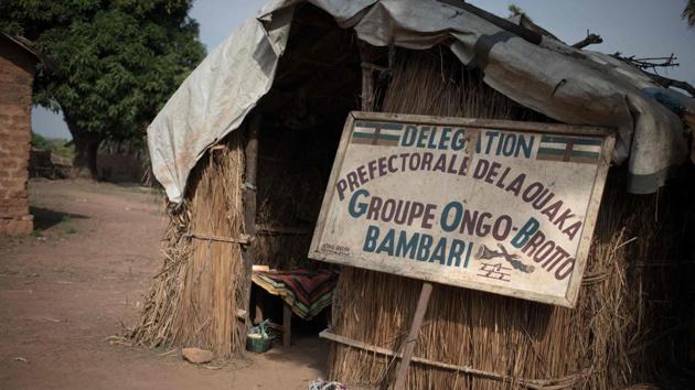 A sign indicating the house of the traditional group of dancers “Ongo-Broto” in Bambari. In the early 2000s, the troupe performed as far away as in France and Algeria. But since then, opportunities have dwindled. The troupe has only one performance lined this year –sounding their trumpets at Bangui’s French cultural centre at the end of 2019. (Florent Vergenes / AFP) A sign indicating the house of the traditional group of dancers “Ongo-Broto” in Bambari. In the early 2000s, the troupe performed as far away as in France and Algeria. But since then, opportunities have dwindled. The troupe has only one performance lined this year –sounding their trumpets at Bangui’s French cultural centre at the end of 2019. (Florent Vergenes / AFP)