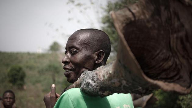 A Broto man holds his traditional horn on his shoulder, in Bambari. Under threat of fading out at the hands of modernity, the Broto musical tradition was doubly hit by the outbreak of the Central African crisis in 2013 and the violence that spread in its wake. (AFP) A Broto man holds his traditional horn on his shoulder, in Bambari. Under threat of fading out at the hands of modernity, the Broto musical tradition was doubly hit by the outbreak of the Central African crisis in 2013 and the violence that spread in its wake. (AFP)