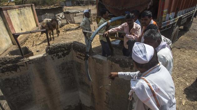 Villagers in Karjat village cleaned a common well abandoned for 27 years by removing tonnes of silt from it. The well will now use it to store the water supplied by government through tankers. It’s either our children or our cattle,” said Suresh Jadhav, sarpanch of Jalna’s Bondhalapuri village. “Butchers are ready to buy buffaloes at a fourth of the market price.” (Pratik Chorge / HT Photo)