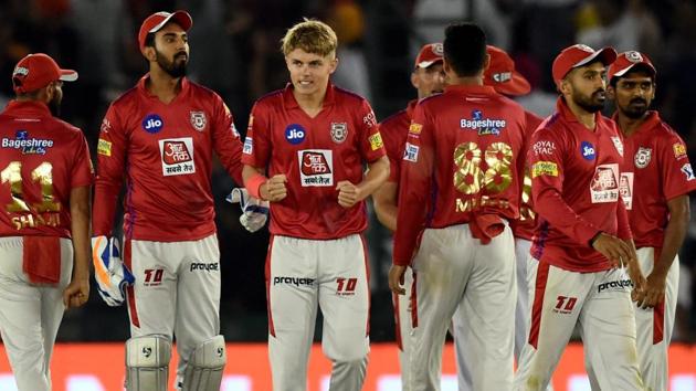 Kings XI Punjab (KXIP) player Sam Curran with teammates celebrates his team's victory.(PTI)