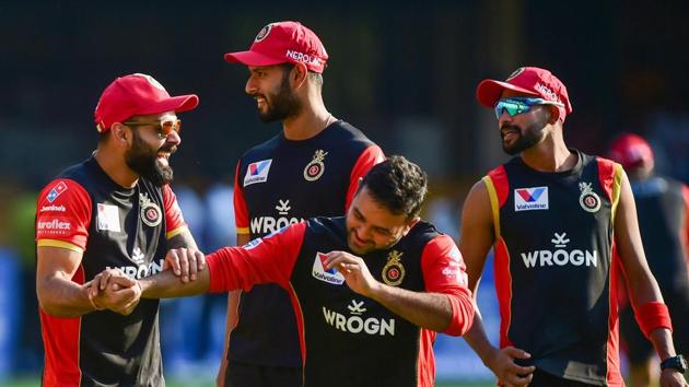 Bengaluru: Royal Challengers Bangalore's Skipper Virat Kohli with teammate Parthiv Patel and others share a lighter moment(PTI)
