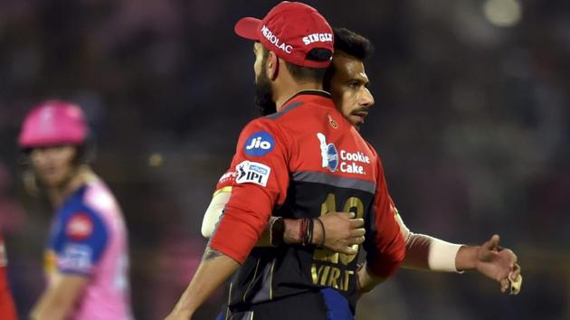 Royal Challengers Bangalore (RCB) bowler Yuzvendra Chahal celebrates the wicket of Jos Buttler. (PTI)