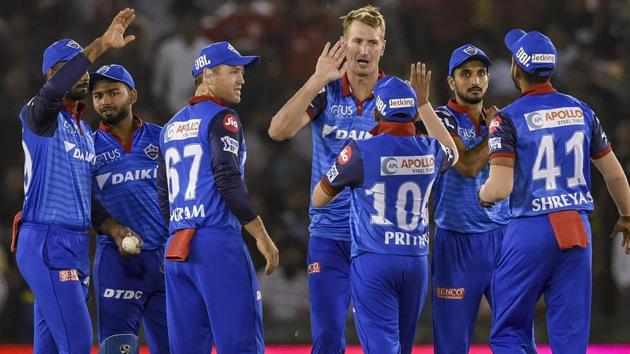 DC's Chris Morris along with team members celebrates after claiming the wicket of KXIP's K L Rahul. (PTI)