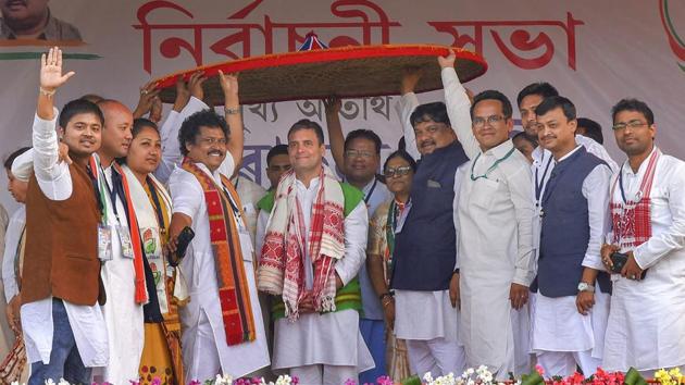 Congress President Rahul Gandhi is felicitated with a traditional Assamese Japi (hat) during a public rally ahead of the Lok Sabha elections at Bokakhat, in Golaghat district, Assam. While addressing the rally Gandhi said, “If voted to power, Congress will not allow Citizenship Amendment Bill. Congress will restore special status of northeastern states”. (PTI)