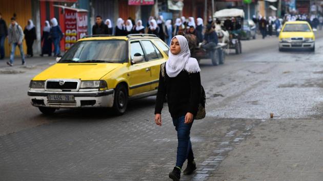 Children make their way through the streets as they head to school in Gaza City. The streets are packed with kids and their rucksacks just before 7 am. In 2017, a Palestinian Central Bureau of Statistics report said more than 40% of Gazans were under 15 years old. Just 3.3% of Palestinians over 15 were illiterate. (Dylan Martinez / REUTERS) Children make their way through the streets as they head to school in Gaza City. The streets are packed with kids and their rucksacks just before 7 am. In 2017, a Palestinian Central Bureau of Statistics report said more than 40% of Gazans were under 15 years old. Just 3.3% of Palestinians over 15 were illiterate. (Dylan Martinez / REUTERS)