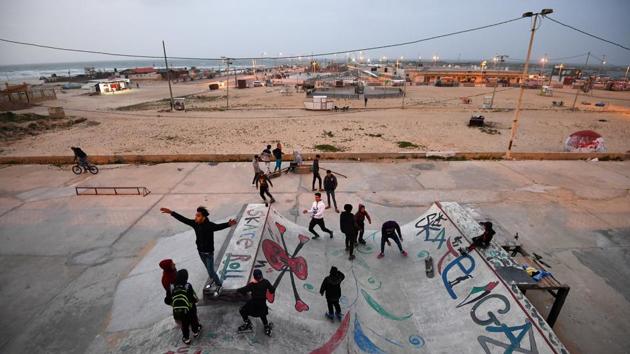 On Friday, away from the protests, Martinez went to the beach to see what was going on. “I really understood that not 2 million people had gone to the border to clash with the Israelis. What else were they doing?” he said. He found skaters with perhaps two boards between them, some pretty ropey roller blades... “just busy filming themselves trying to do flips, trying to do tricks, things like that.” (Dylan Martinez / REUTERS) On Friday, away from the protests, Martinez went to the beach to see what was going on. “I really understood that not 2 million people had gone to the border to clash with the Israelis. What else were they doing?” he said. He found skaters with perhaps two boards between them, some pretty ropey roller blades... “just busy filming themselves trying to do flips, trying to do tricks, things like that.” (Dylan Martinez / REUTERS)