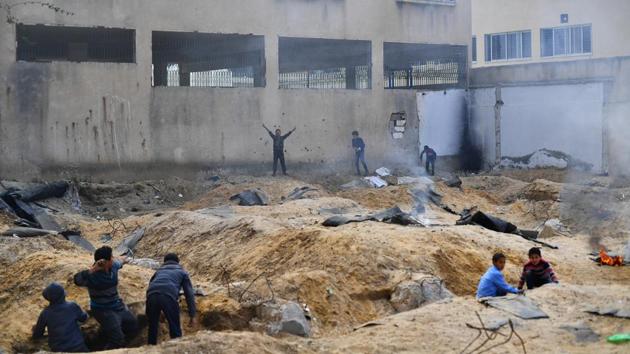 Children play a game of “Arabs and Jews” outside a school. “These kids were burning some cardboard, they had trenches, they were throwing sandballs so they weren't hurting each other. And I said, ‘Oh, what are you guys doing?’ and they said, ‘Oh, we are playing Jews and Arabs.’” The image, Martinez said, “will probably stay with me forever.” (Dylan Martinez / REUTERS) Children play a game of “Arabs and Jews” outside a school. “These kids were burning some cardboard, they had trenches, they were throwing sandballs so they weren't hurting each other. And I said, ‘Oh, what are you guys doing?’ and they said, ‘Oh, we are playing Jews and Arabs.’” The image, Martinez said, “will probably stay with me forever.” (Dylan Martinez / REUTERS)