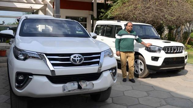 Sunchit Sobti with bulletproof vehicles at the Laggar Industries workshop. The market for such cars in India is worth $150 million a year and growing by double digits, industry representatives said. Companies like Mahindra & Mahindra, and Tata Motors, also offer a small range of pre-made armoured vehicles for civilian use. The outlay is considerable, costing anywhere between $7,000 and $70,000. (Narinder Nanu / AFP)