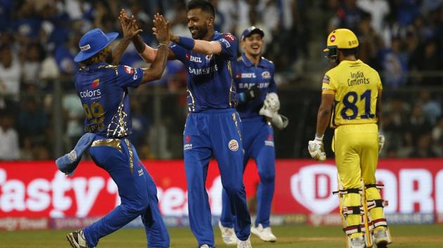 Mumbai Indians Hardik Pandya, center, celebrates with his teammates the dismissal of Chennai Super Kings Mahendra Singh Dhoni. (AP)