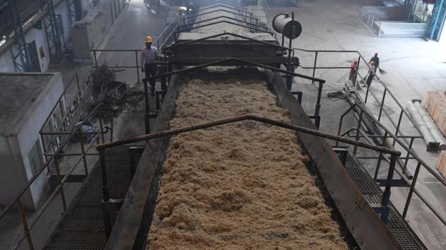 A worker walks next to crushed sugarcane at the Triveni factory. As of last month, some $3 billion was owed to sugarcane growers, according to government data. “The government needs to set a higher minimum price for sugar -- adequate to cover the cost of cane,” Abhinash Verma of the Indian Sugar Mill Association told AFP. (Sajjad Hussain / AFP) A worker walks next to crushed sugarcane at the Triveni factory. As of last month, some $3 billion was owed to sugarcane growers, according to government data. “The government needs to set a higher minimum price for sugar -- adequate to cover the cost of cane,” Abhinash Verma of the Indian Sugar Mill Association told AFP. (Sajjad Hussain / AFP)