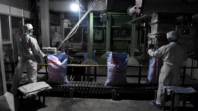 Workers pack processed sugar. On Tuesday the main opposition Congress party released its manifesto promising to waive all farmer loans and ensure “remunerative prices”, saying it has “heard the cry of anguish of farmers and feels the pain of their acute distress”. (Sajjad Hussain / AFP) Workers pack processed sugar. On Tuesday the main opposition Congress party released its manifesto promising to waive all farmer loans and ensure “remunerative prices”, saying it has “heard the cry of anguish of farmers and feels the pain of their acute distress”. (Sajjad Hussain / AFP)