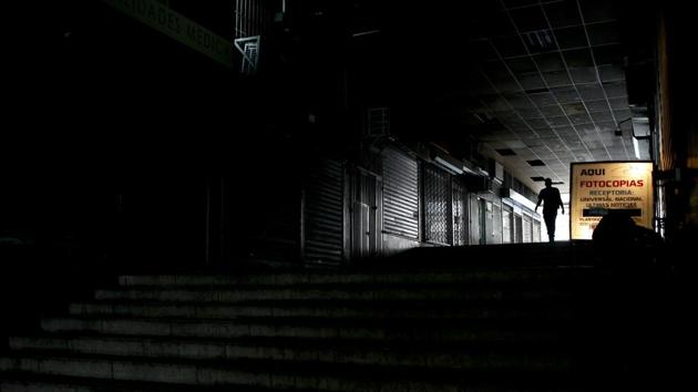 A woman walks through a small shopping center where almost all the shops are shuttered. Caracas’ La Mercedes neighbourhood, famous for its upscale shopping and nightlife, hasn’t been spared. Many of its pubs and fancy restaurants are devoid of waiters and customers. (Natacha Pisarenko / AP) A woman walks through a small shopping center where almost all the shops are shuttered. Caracas’ La Mercedes neighbourhood, famous for its upscale shopping and nightlife, hasn’t been spared. Many of its pubs and fancy restaurants are devoid of waiters and customers. (Natacha Pisarenko / AP)