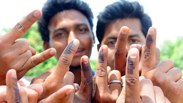 Ranchi, Jharkhand, INDIA – April 17: (FILE PHOTO) Rural first time voters happily showing their voting mark after casting their votes for 2nd phase election of Lok Sabha poll for Ranchi constituency at a polling booth at Rampur in Ranchi on Thursday April 17, 2014-(Photo-Parwaz Khan-Hindustan Times) PHOTO FOR REPRESENTATIONAL PURPOSE