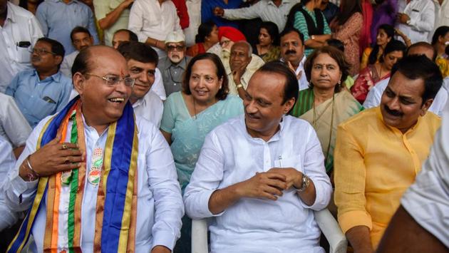 (From left) Mohan Joshi, Congress Pune Lok Sabha candidate; NCP leader Ajit Pawar and Congress leader Harshvardhan Patil after Joshi was being declared as the Congress candidate from Pune constituency, on Tuesday. (SANKET WANKHADE/HT PHOTO) 