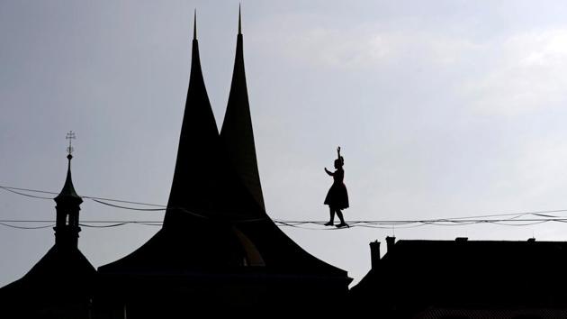 A tightrope walker performs on ropes stretched over the Emmaus Monastery in Prague, Czech Republic. (David W Cerny / REUTERS) A tightrope walker performs on ropes stretched over the Emmaus Monastery in Prague, Czech Republic. (David W Cerny / REUTERS)