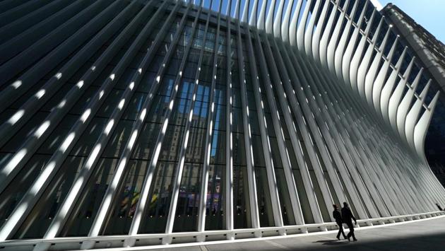 People walk past the Oculus which serves as the centrepiece of the World Trade Centre Transportation Hub in New York, incorporating 78,000 square feet of multi level state-of-the-art retail and dining. (Timothy A. Clary / AFP) People walk past the Oculus which serves as the centrepiece of the World Trade Centre Transportation Hub in New York, incorporating 78,000 square feet of multi level state-of-the-art retail and dining. (Timothy A. Clary / AFP)